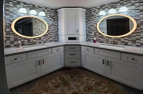 Newly installed white bathroom cabinets